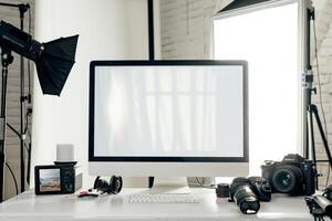 Computer Mockup Background on a white desk with graphy gear and  tech setup Background photo