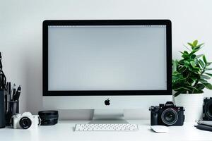 Computer Mockup Background on a white desk with graphy gear and tech gadgets arranged Background photo