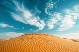 Sand Dunes Under a Blue Desert Sky with Distant Mountains for Wilderness graphy Background photo