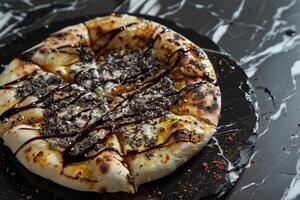 Gourmet Pizza with Truffle Oil Drizzle on  Marble Table Sophisticated Cuisine photo