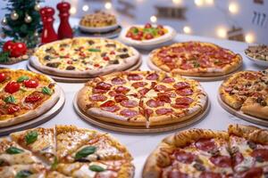 Festive Pizza Party Featuring Various Assorted Pizzas and Tasty Toppings on a Joyful Table photo