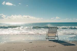 Beach chair alone facing the ocean with gentle waves providing a serene and picturesque seasidebackground photo