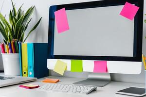 White desk with computer mockup and surrounding sticky notes ideal for planning and  projects background photo