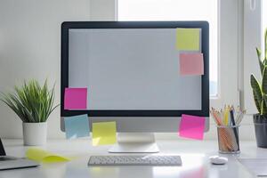 Computer mockup on a white desk with sticky notes perfect for  brainstorming and project planning background photo