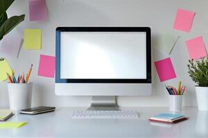 White desk with computer mockup and sticky notes around showcasing a  and efficient workspace background photo