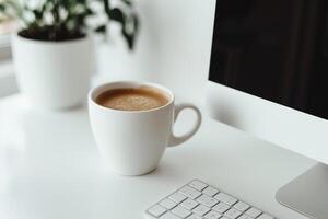 Computer mockup with sticky notes and coffee cup on a white desk ideal for a  and comfortable office environment background photo