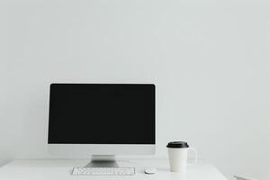 White desk with computer mockup sticky notes and coffee cup creating a  and  workspace setup background photo