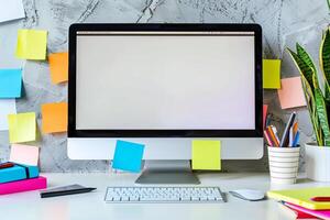 White desk featuring computer mockup sticky notes and a coffee cup ideal for work and  brainstorming background photo