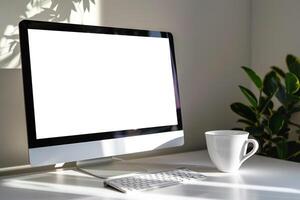 Computer Mockup on White Desk with Coffee Cup    and  Workspace Background photo