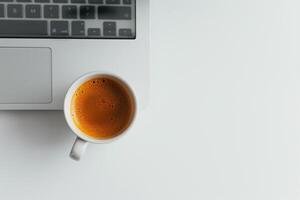 Computer Mockup on White Desk with Coffee Cup    and Functional Background photo