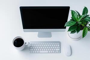 Computer Mockup on White Desk with Coffee Cup    and  Workspace Background photo