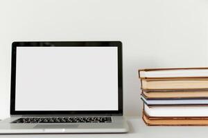 Laptop Mockup with Coding Books on Desk    and  Workspace Background photo