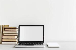 Laptop Mockup and Coding Books    and  Workspace Arrangement photo