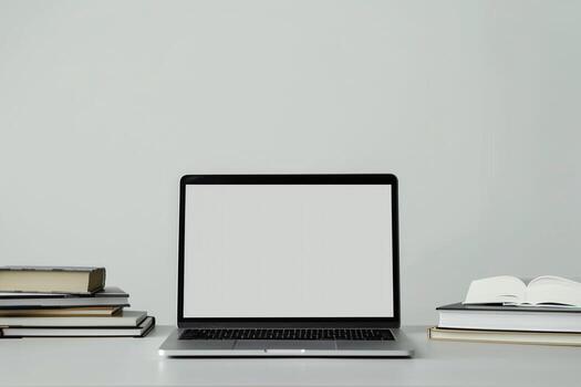 Laptop Mockup with Coding Books for Developers Desk Background photo