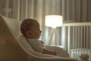 Baby in a nursery with  lines and design elements photo