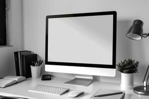 Computer Mockup Background on a White Desk with Books photo