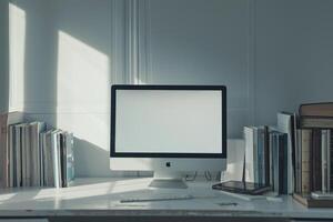 Computer Mockup Background on a White Desk with Books photo