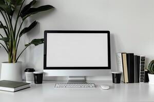 Computer Mockup Background on a White Desk with Books photo