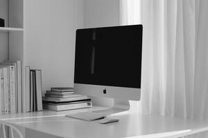White Desk with Computer Mockup and Stacked Books Concentrated Study Workspace photo