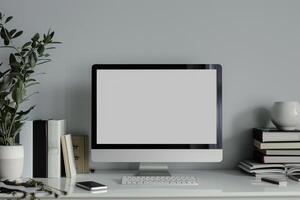 Computer Mockup on White Desk with Books Stacked Study Area Background ed photo