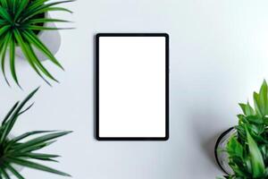 Tablet Displayed on Desktop Setup with Office Accessories photo