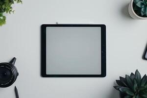Tablet Positioned on Desktop Setup with Office Decor photo