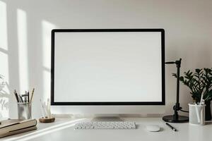 Computer Mockup Background on White Desk with Writing Essentials photo