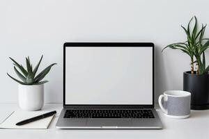 Laptop Mockup on White Desk with Open Notebook and  Writing Setup photo