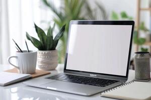 Laptop Mockup with Blank Notebook Open on White Desk photo