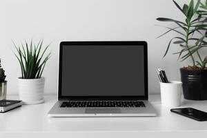 Laptop Mockup with Blank Notebook Open on White Desk photo