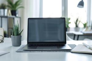 Laptop Mockup with Blank Notebook Open on White Desk photo