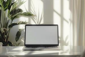 Laptop Mockup with Blank Notebook Open on White Desk photo