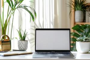 Laptop Mockup with Blank Notebook Open on White Desk photo