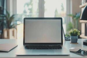 Laptop Mockup with Blank Notebook Open on White Desk photo