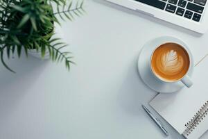Laptop Mockup with Blank Notebook Open on White Desk photo