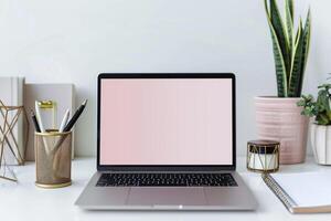 Laptop Mockup with Blank Notebook Open on White Desk photo