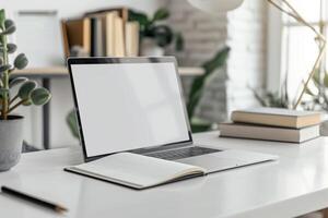 Laptop Mockup with Blank Notebook Open on White Desk photo