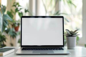 Setup with Laptop Mockup and Open Notebook on White Desk Background photo
