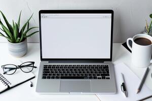 Work Setup with Laptop Mockup and Open Notebook on White Desk Background photo
