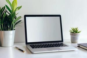 White Desk with Laptop Mockup and Open Notebook for   Work and Writing Background photo