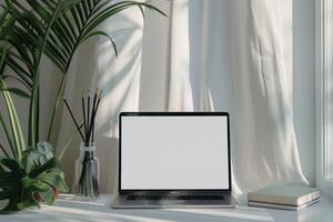 Open Notebook and Laptop Mockup on White Desk for   Writing and Work Setup photo