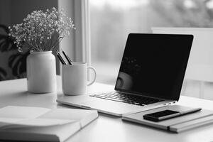 Writing and Laptop Mockup Setup with Open Notebook on White Desk Background photo