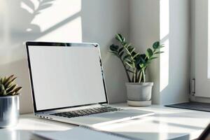 Laptop Mockup with Open Notebook on White Desk for   Writing Background photo