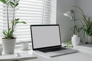 Writing and Laptop Mockup Setup on White Desk with Open Notebook Background photo