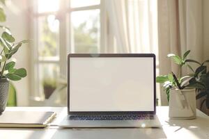 Open Notebook and Laptop Mockup on White Desk for   Work and Writing Background photo