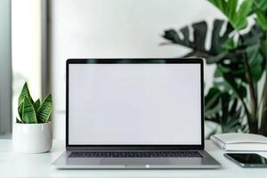 White Desk Background with Laptop Mockup and Open Notebook for   Work Setup photo