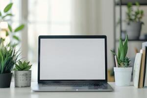 Laptop Mockup with Open Notebook on White Desk for   Writing and Work Setup photo
