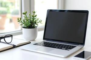 White Desk with Laptop Mockup and Open Notebook for   Work Background photo