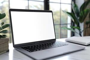 White Desk Background with Laptop Mockup and Open Notebook for   Writing and Work photo