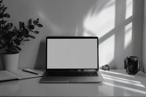 White Desk Background with Laptop Mockup and Open Notebook for   Work and Writing photo